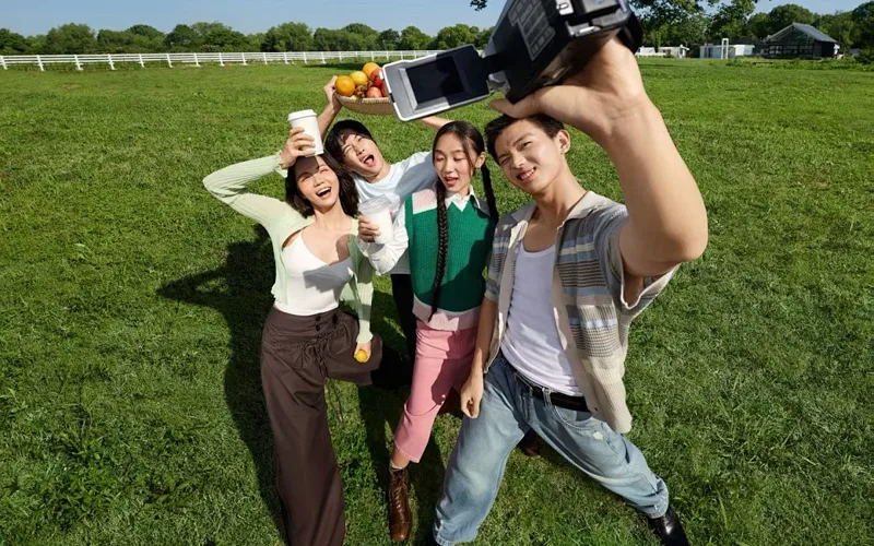 Friends outdoors ready to share at a smaller size